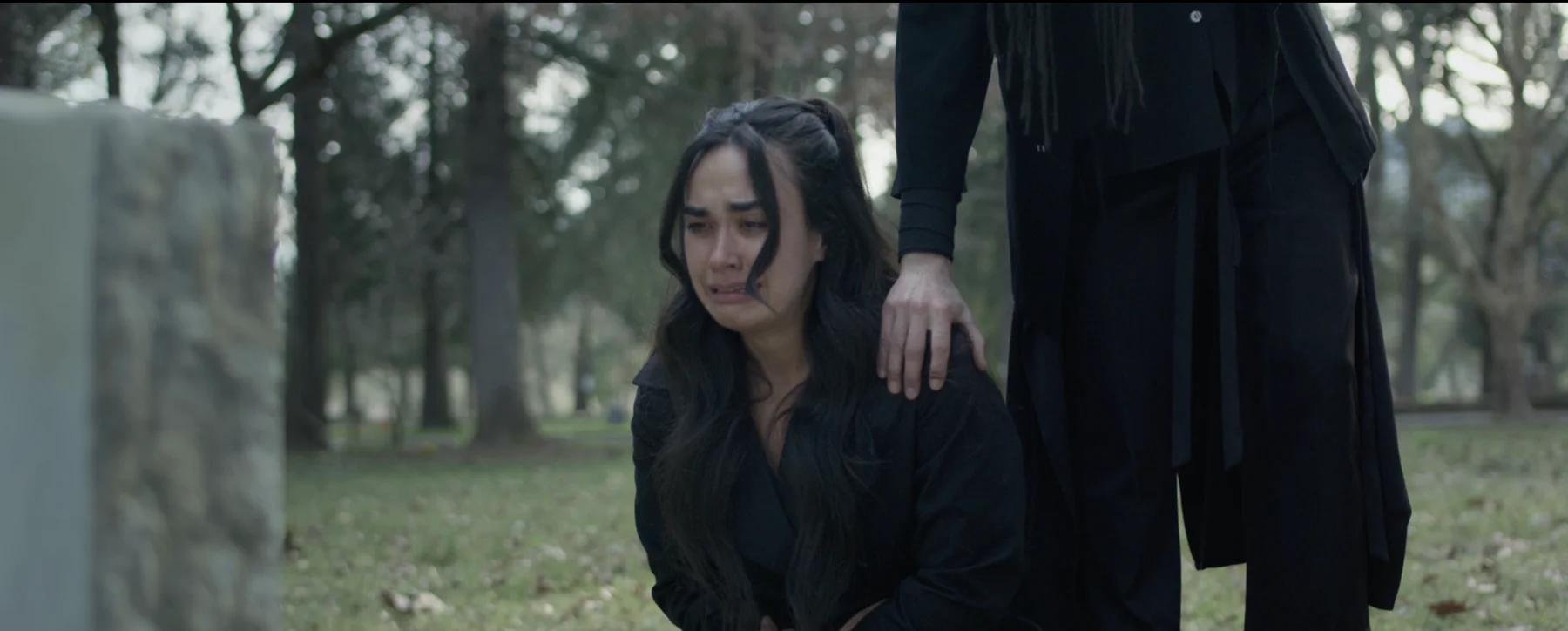 Albedo film still — grief at the graveside
