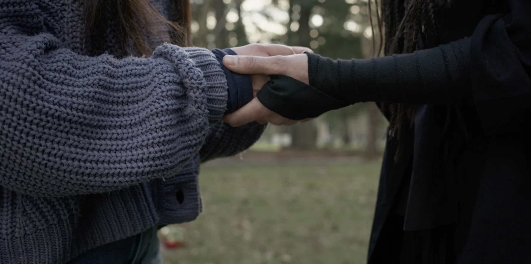 Albedo film still — holding hands